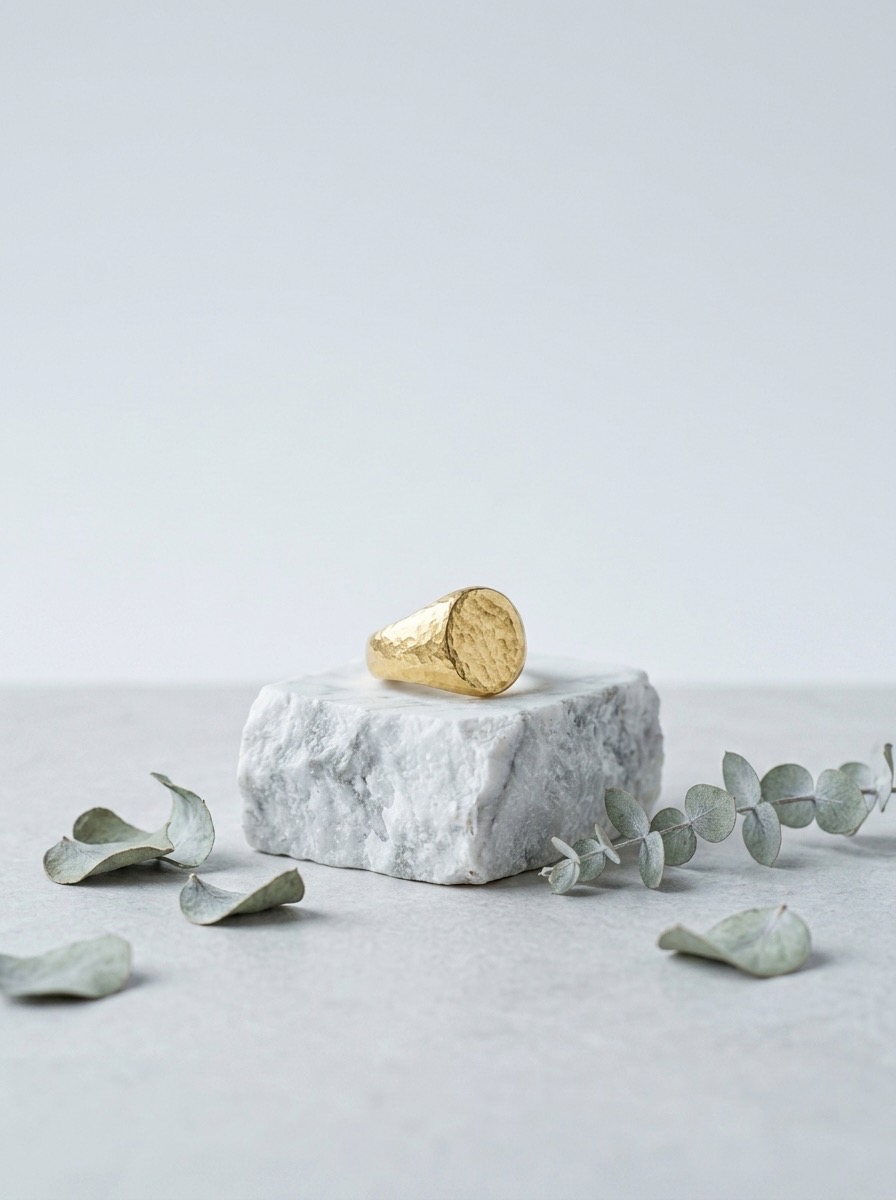 Gold signet ring — wide shot